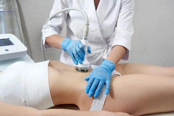 Lost the Weight but Not the Loose Skin? 2 woman having HIFU treatment on her stomach to combat loose skin Bridgnorth following weight loss